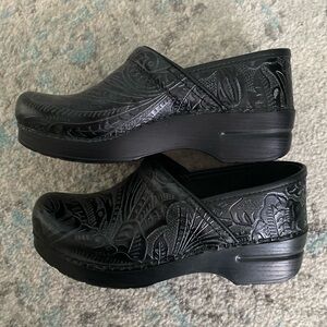 Dansko clogs slip on shoes tooled black floral design. Size 39.